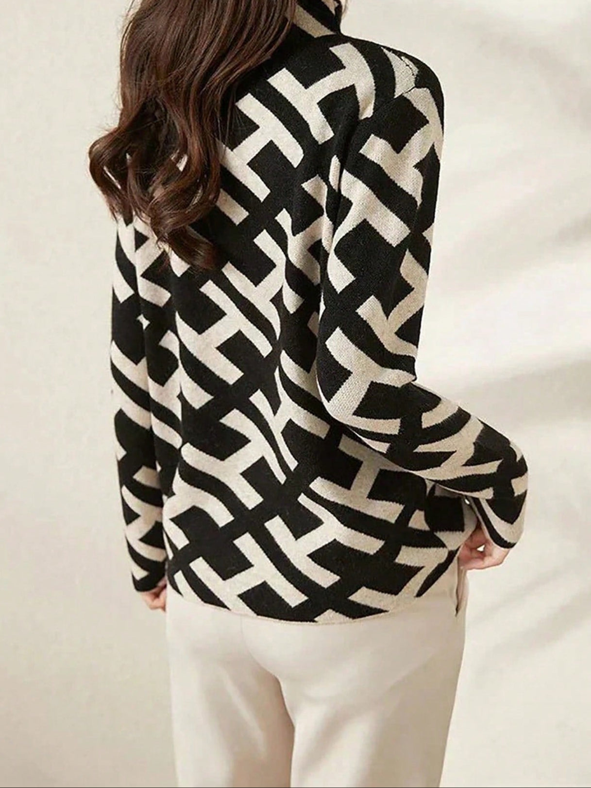 Geometric sweater with black alphabet