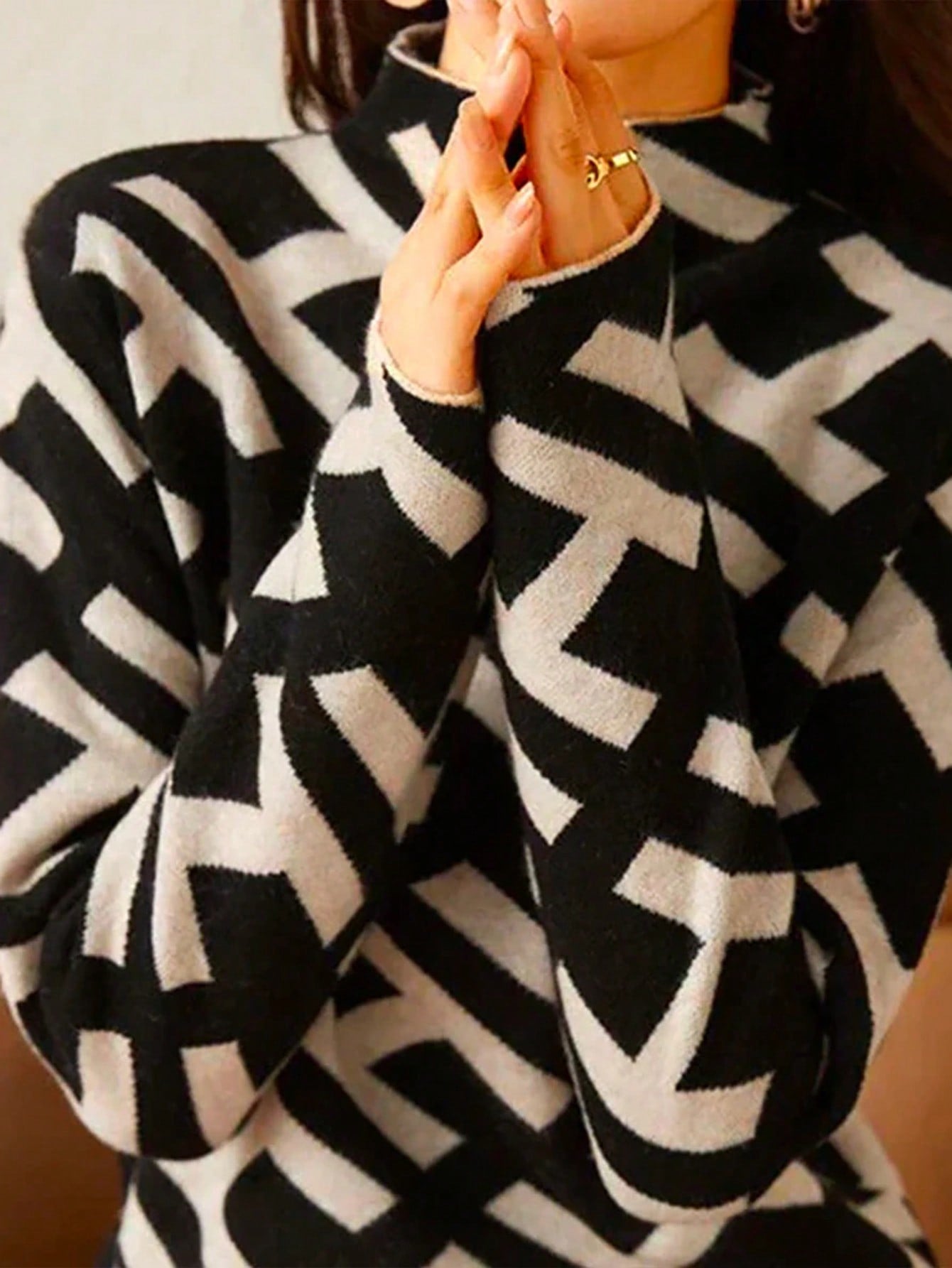 Geometric sweater with black alphabet