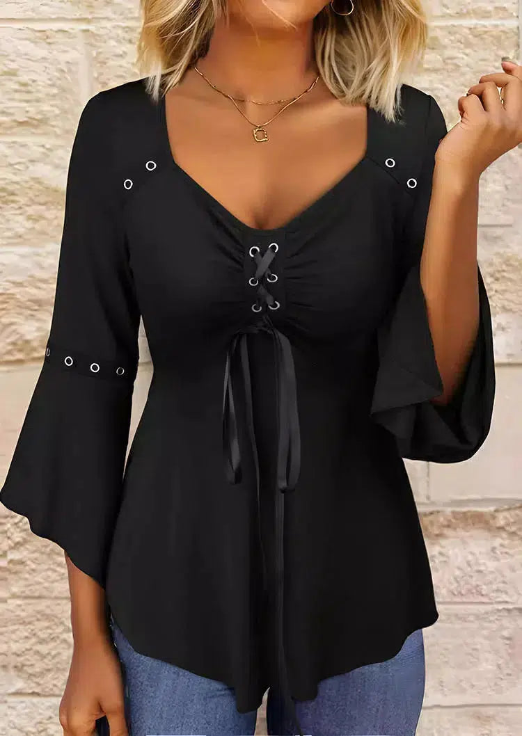 Black solid color top with V-neckline